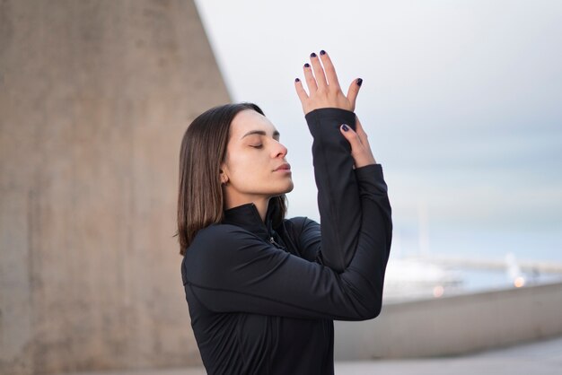 Medium shot woman meditation pose