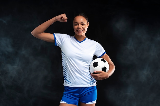 Medium shot woman playing football