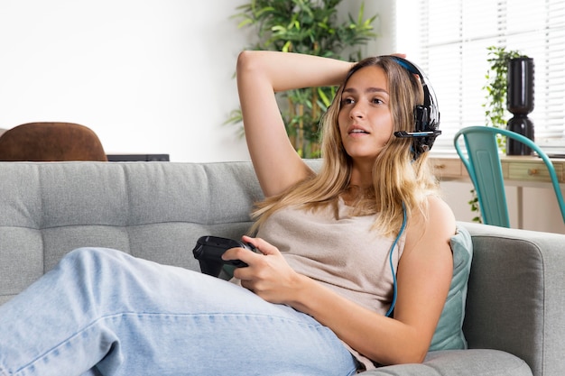 Free photo medium shot woman playing game with controller