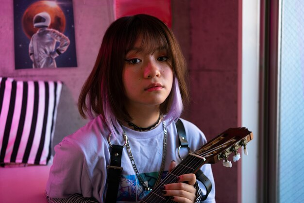 Medium shot woman posing guitar