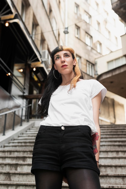 Medium shot woman posing outdoors