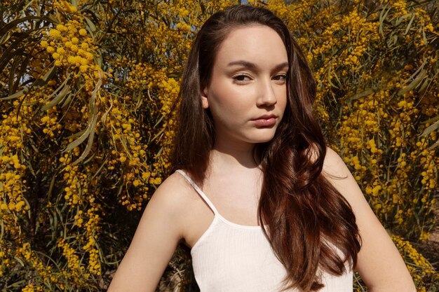 Medium shot woman posing outdoors