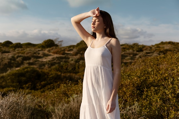 Free Photo medium shot woman posing outside