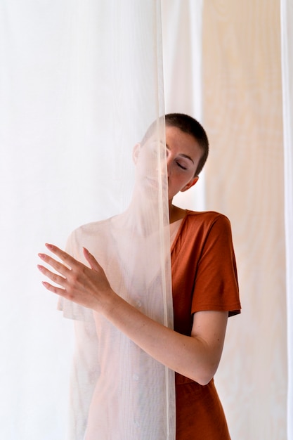 Medium shot woman posing in studio