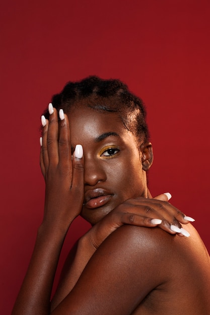 Medium shot woman posing in studio