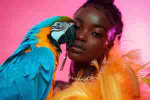 Free photo medium shot woman posing with parrot