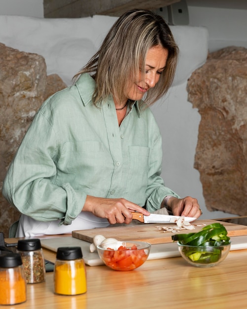 Medium shot woman preparing meal