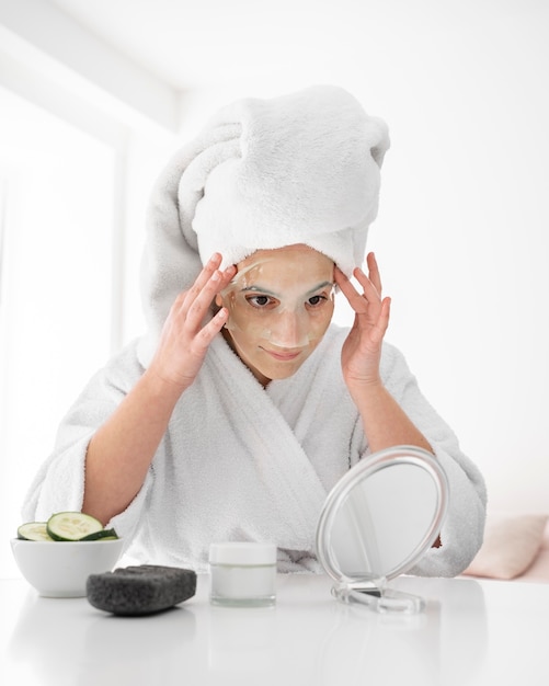 Medium shot woman putting on mask