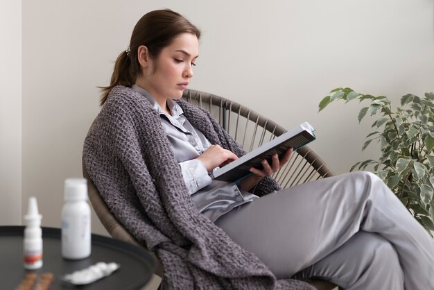 Medium shot woman reading book