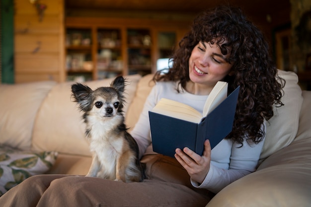 Medium shot woman reading book