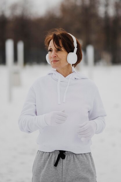 Medium shot woman running outside