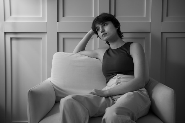 Medium shot woman sitting on chair