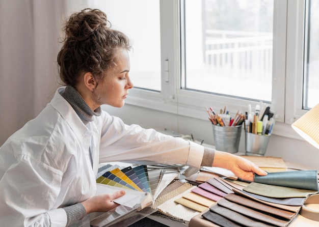 Medium shot woman sitting at desk