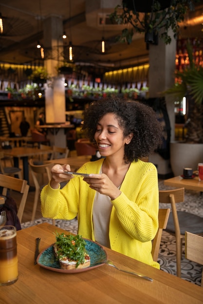 Medium shot woman sitting at table