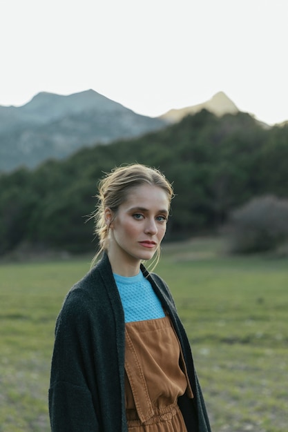 Medium shot woman staring at camera