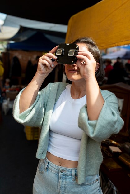 Medium shot woman taking photos