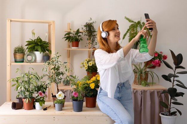 Medium shot woman taking selfie