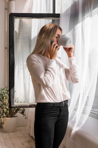 Medium shot woman talking on phone