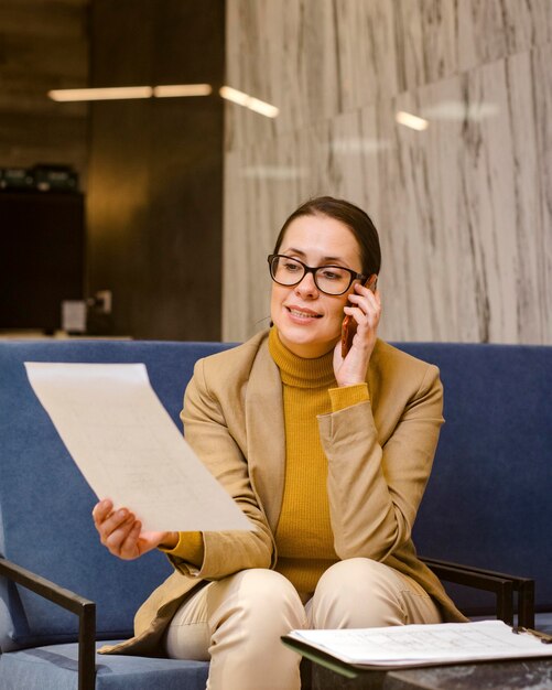 Medium shot woman talking on phone