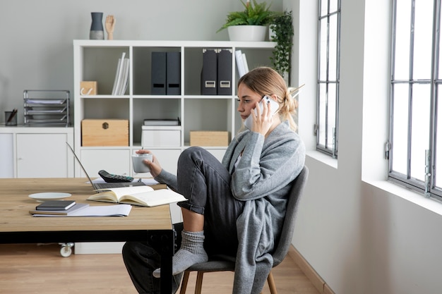 Medium shot woman talking on phone