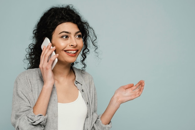 Medium shot woman talking on phone