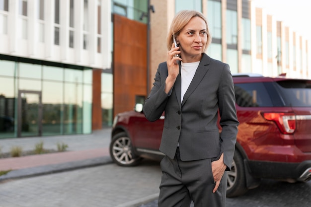 Medium shot woman talking on phone