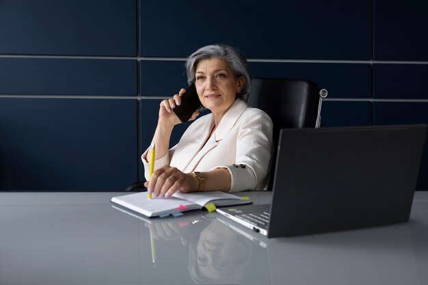 Medium shot woman talking on phone