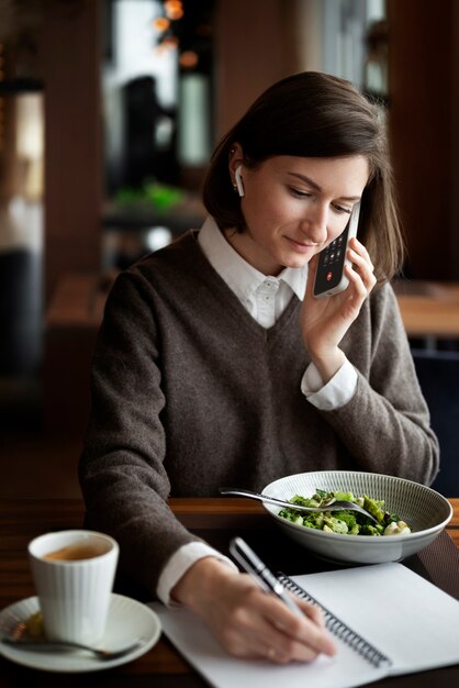 Medium shot woman talking on phone