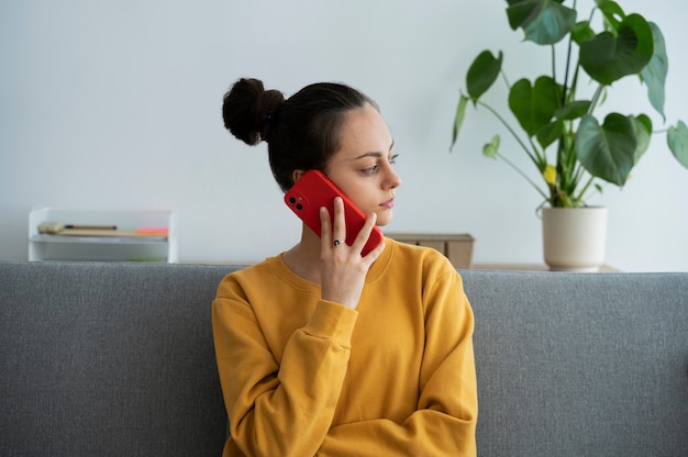 Medium shot woman talking on phone