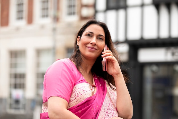 Medium shot woman talking on phone