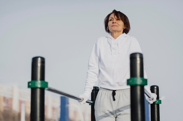 Medium shot woman training outside