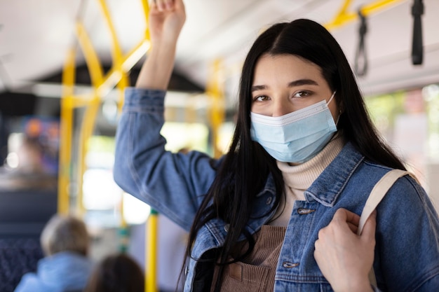 Medium shot woman traveling with mask