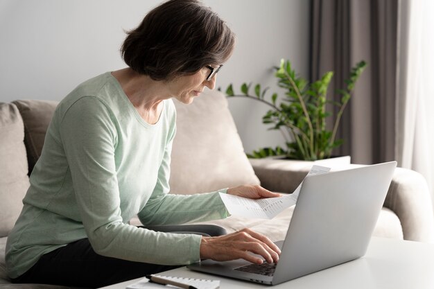 Medium shot woman typing on keyboard