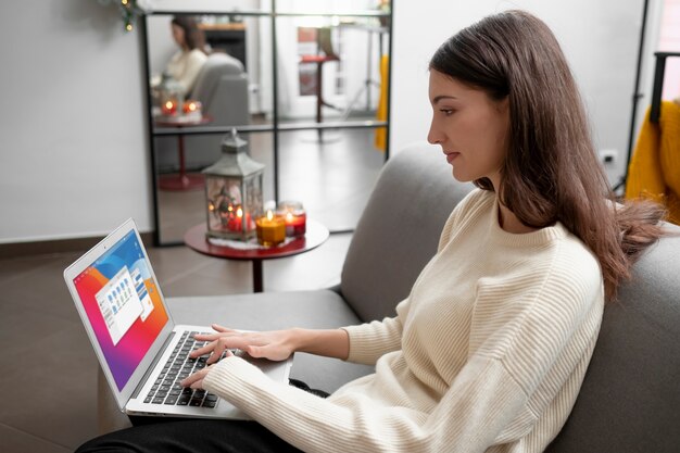 Medium shot woman typing on keyboard