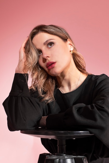 Medium shot woman wearing black dress