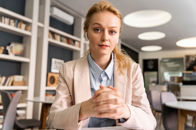 Medium shot woman wearing earphones