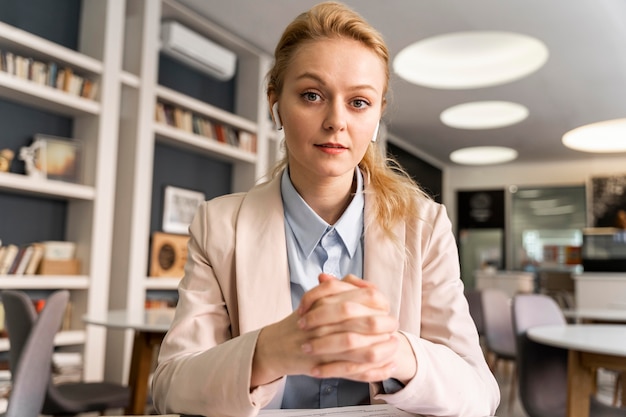 Medium shot woman wearing earphones