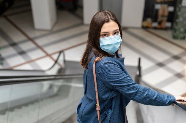 Medium shot woman wearing face mask