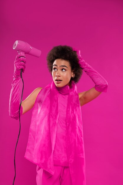 Medium shot woman wearing full pink outfit