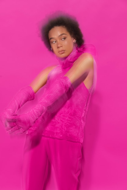 Medium shot woman wearing full pink outfit