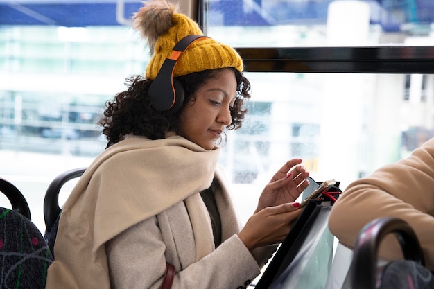 Free photo medium shot woman wearing headphones