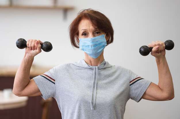 Medium shot woman wearing medical mask