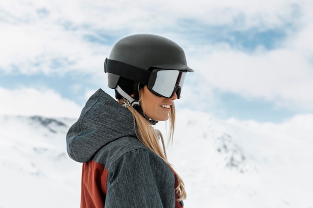 Medium shot woman wearing ski helmet