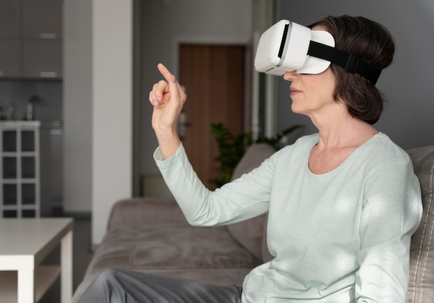 Medium shot woman wearing vr glasses