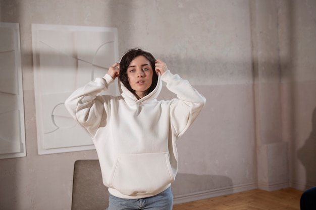 Medium shot woman wearing white hoodie