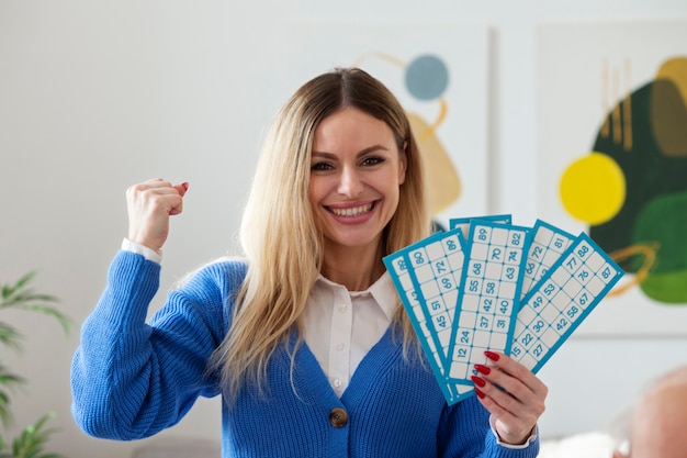 Medium shot woman winning bingo games