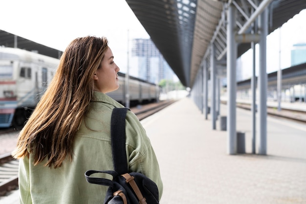 Free photo medium shot woman with backpack