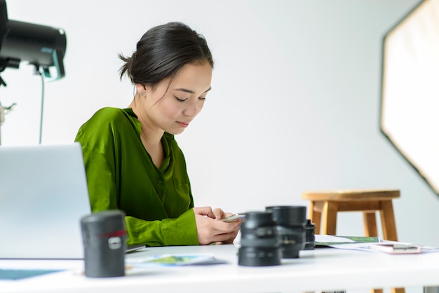 Medium shot woman with camera lenses