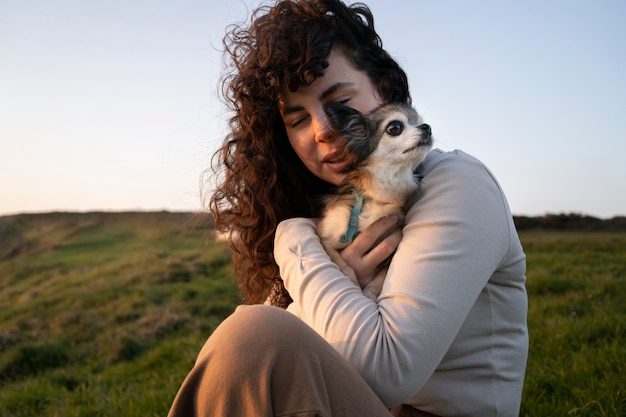 Free Photo medium shot woman with  chihuahua dog