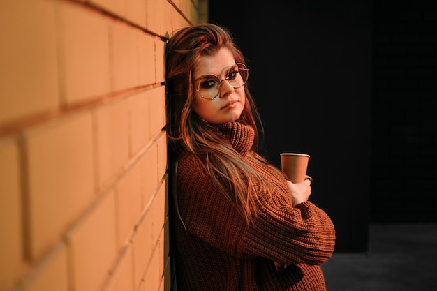 Medium shot woman with coffee cup